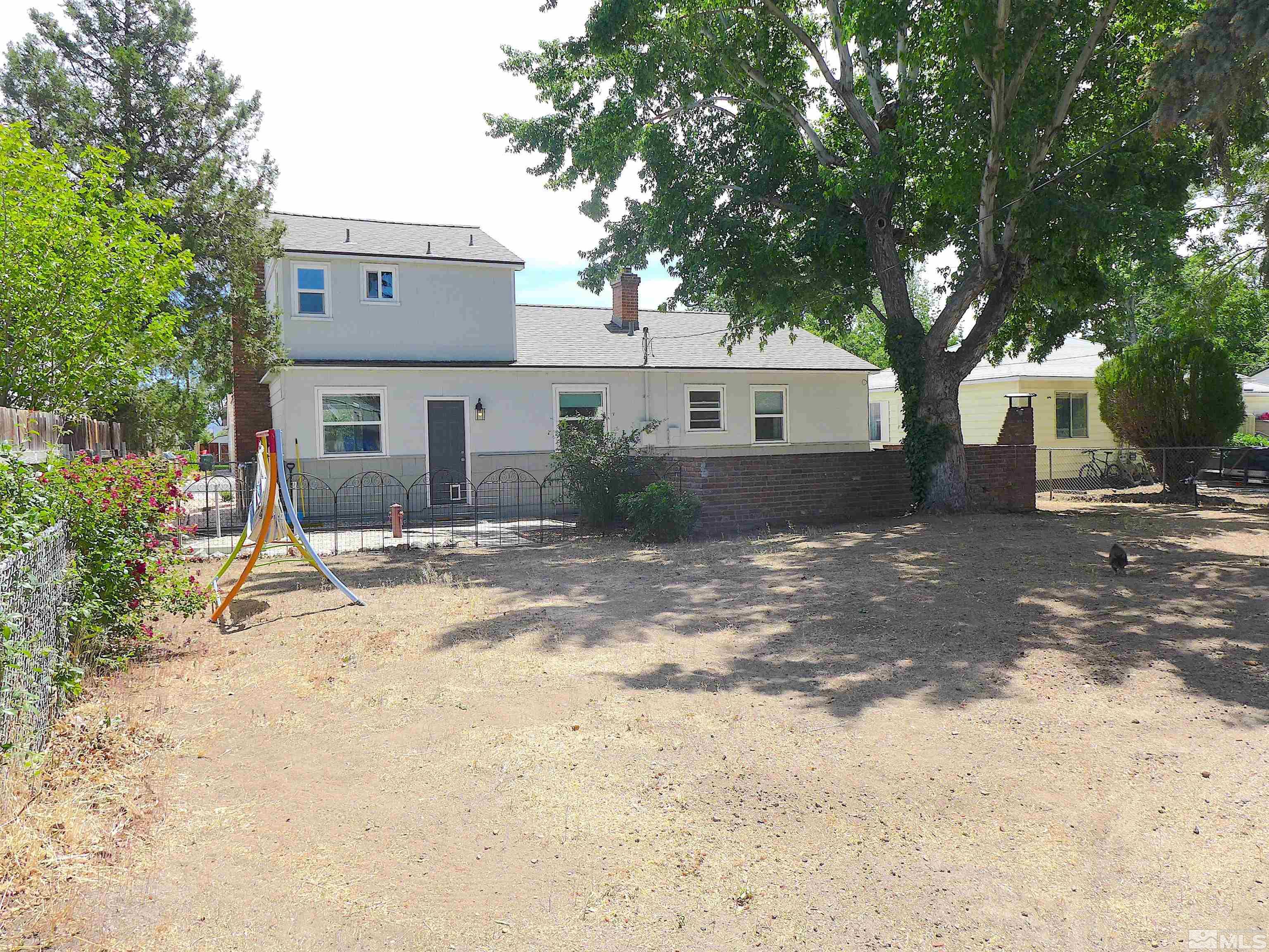 925 Yori Avenue Reno, NV 89502 - Photo 2 of 20 a view of a house with a yard