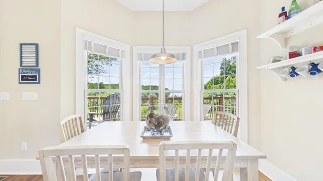 a bathroom with a toilet a sink and a mirror