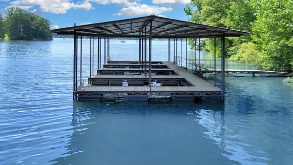a view of a house with a yard porch and sitting area