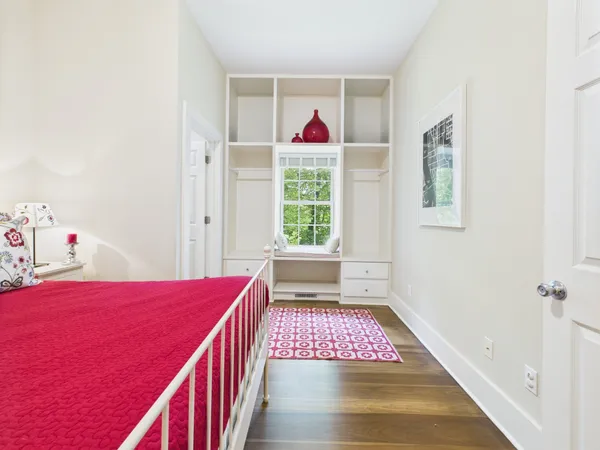 a view of a dining room and livingroom with furniture wooden floor a chandelier