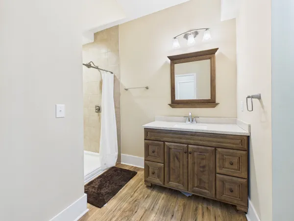 a bathroom with a bathtub and a window