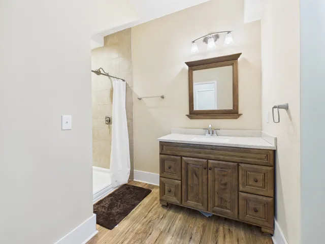 a bathroom with a bathtub and a window