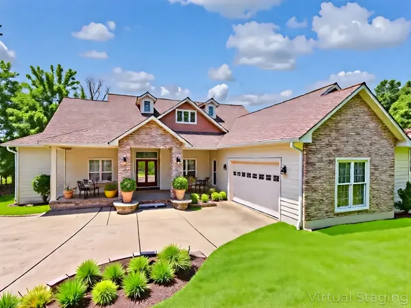 a living room with furniture a flat screen tv and wooden floor