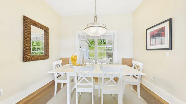 a view of a room with wooden floor and outdoor space