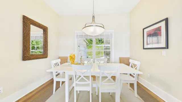 a view of a room with wooden floor and outdoor space