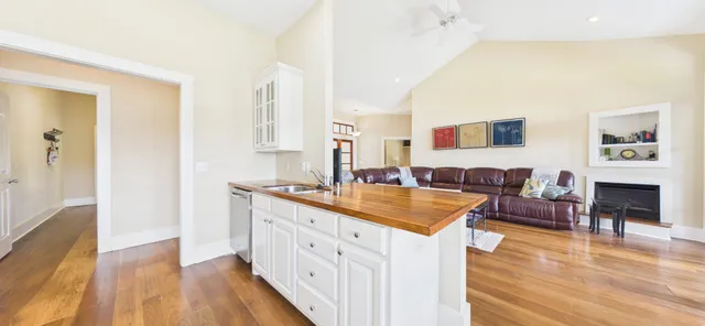 a bedroom with furniture and a large window