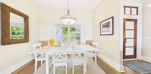 a view of an outdoor dining space with a table and chairs