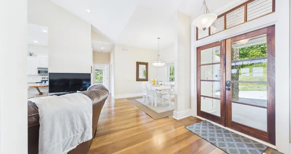 a view of a field with an trees in the background