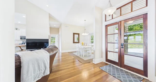 a view of a field with an trees in the background
