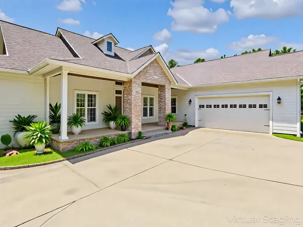 a spacious bedroom with a bed and a large window