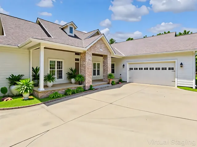 a spacious bedroom with a bed and a large window