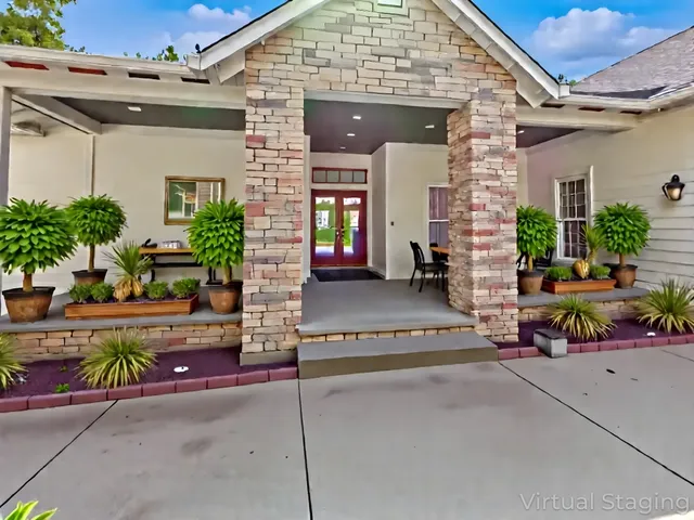 a view of a chairs and table in the balcony