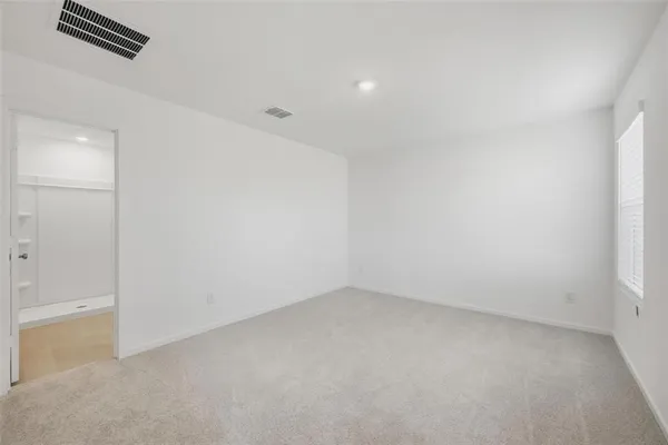 a view of an empty walk in closet