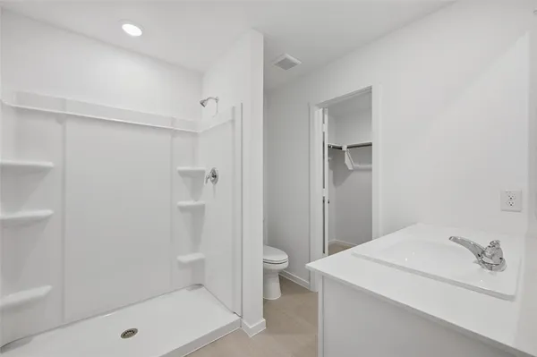 a bathroom with a bathtub and a sink