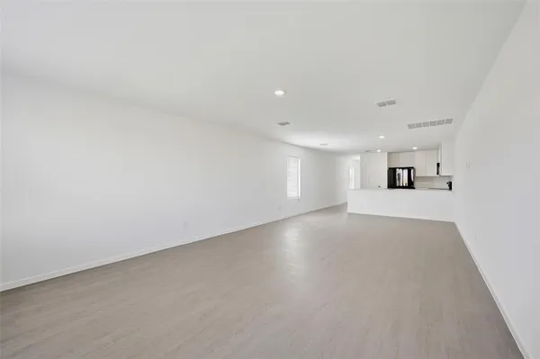 a view of kitchen with stainless steel appliances cabinets