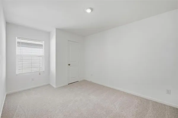 a kitchen with a stove and a refrigerator