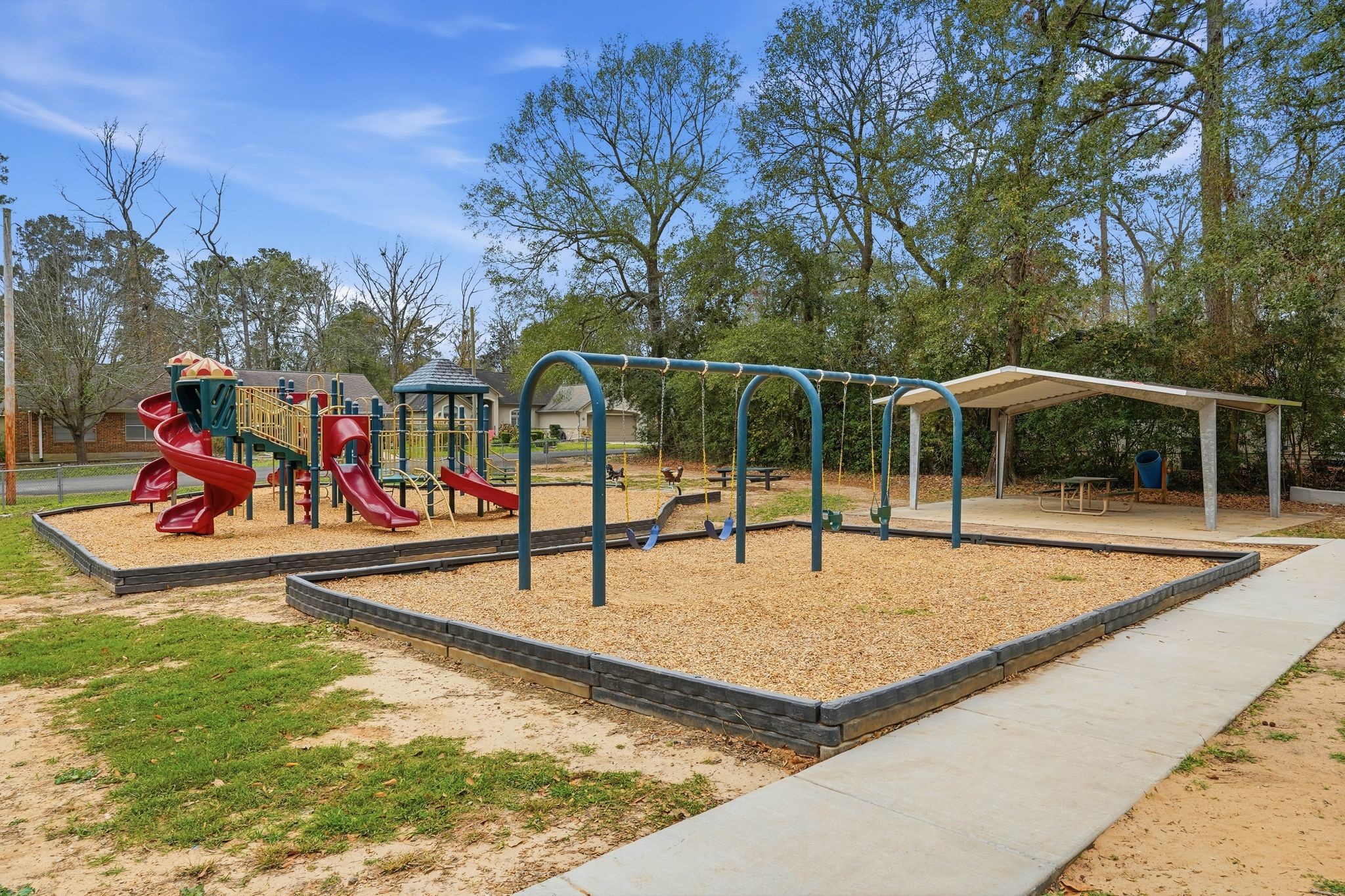 20 Moon Valley Court Conroe, TX 77304 - Photo 28 of 32 a view of a park with swings and slides