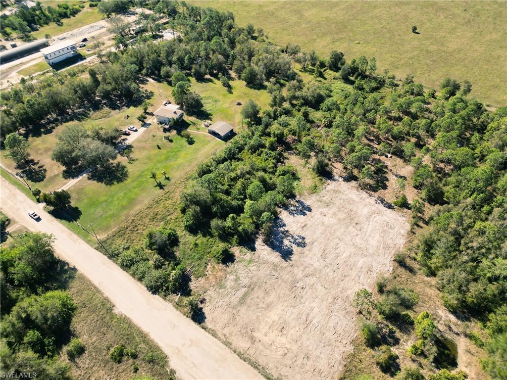 11520 Shawnee Road Fort Myers, FL 33913 - Photo 4 of 13 a view of a bunch of flowers and trees