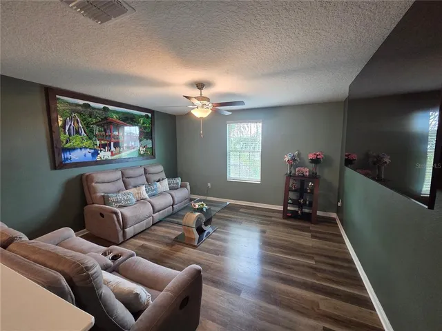 a bedroom with a bed dresser and a window