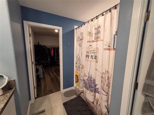 a view of hallway with wooden floor