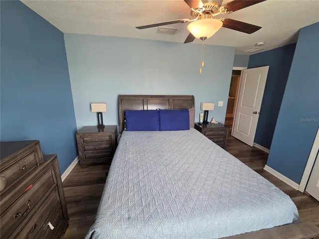 a view of a lake with houses in the back