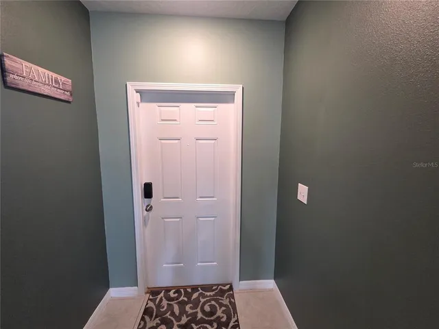 a view of an house with backyard space and deck