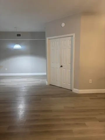 a view of room and wooden floor