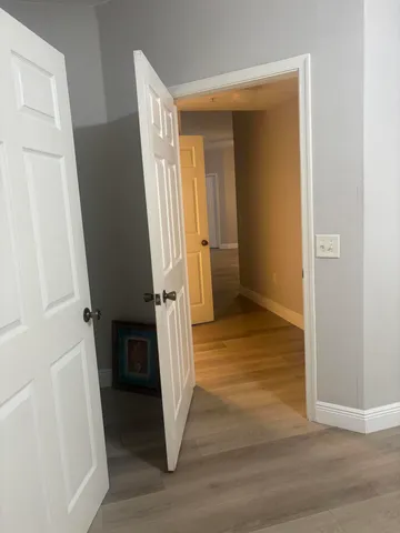 a view of entryway with wooden floor