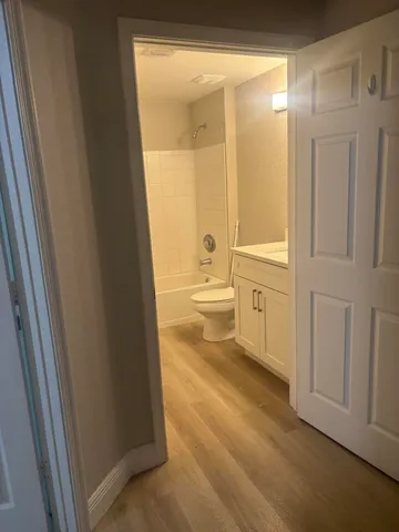 a bathroom with a sink a toilet and a shower