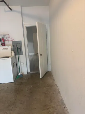 a view of a storage & utility room with a sink