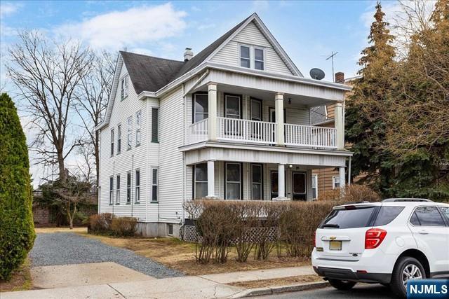 20 Dankoff Avenue, Unit 1 Wallington, NJ 07057 - Photo 1 of 15 a front view of a house with a yard