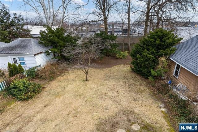 20 Dankoff Avenue, Unit 1 Wallington, NJ 07057 - Photo 13 of 15 a backyard of a house with lots of green space