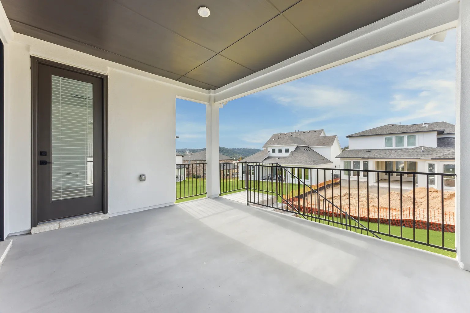 1909 Varese Path Leander, TX 78641 - Photo 38 of 40 A spacious covered deck offers scenic neighborhood views and outdoor living possibilities.