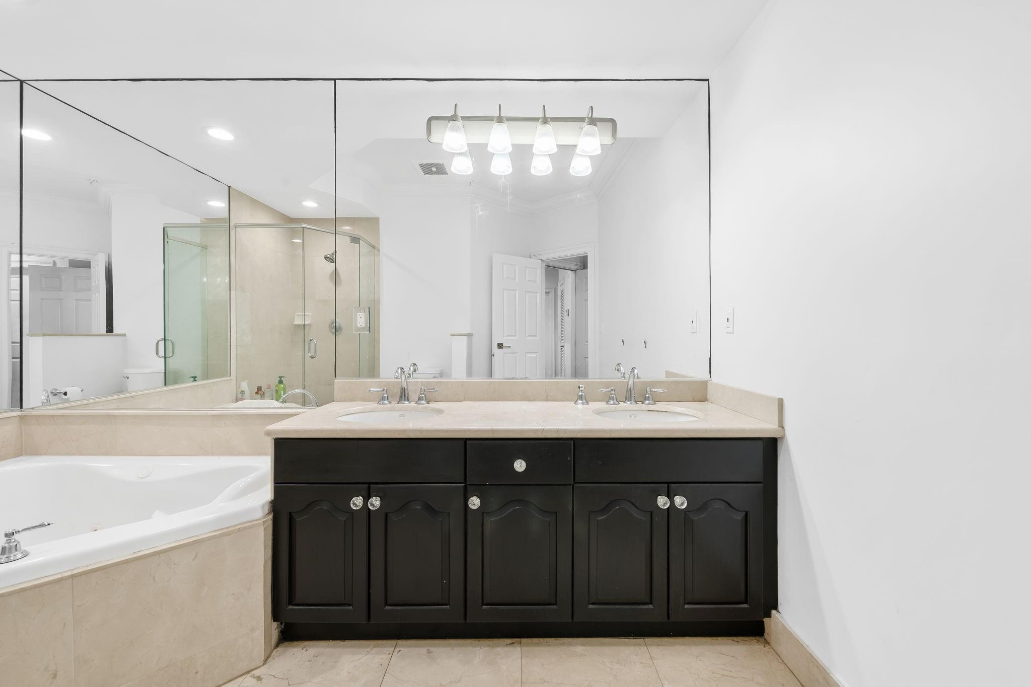 456 East Boca Raton Road Boca Raton, FL 33432 - Photo 28 of 33 a bathroom with a sink and a mirror