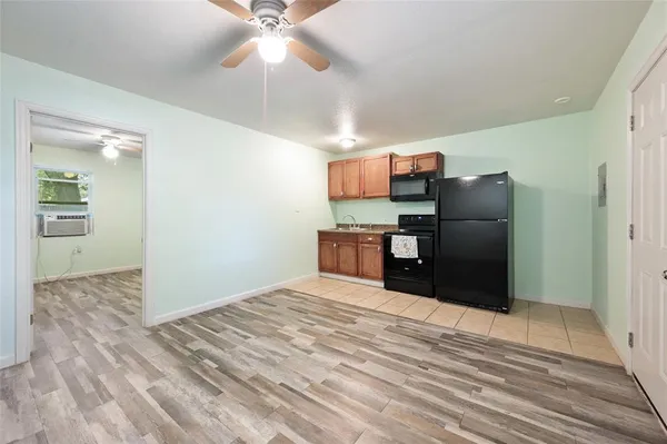 a room with a bed and cabinets