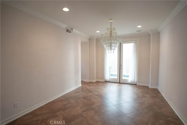 a kitchen with granite countertop stainless steel appliances a refrigerator and cabinets