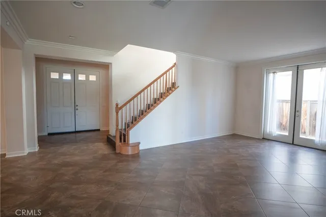 a view of an empty room with a fireplace