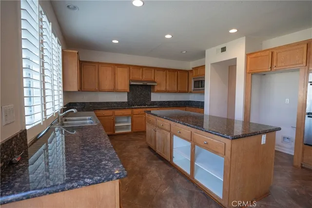 a white toilet sitting next to a small bathroom