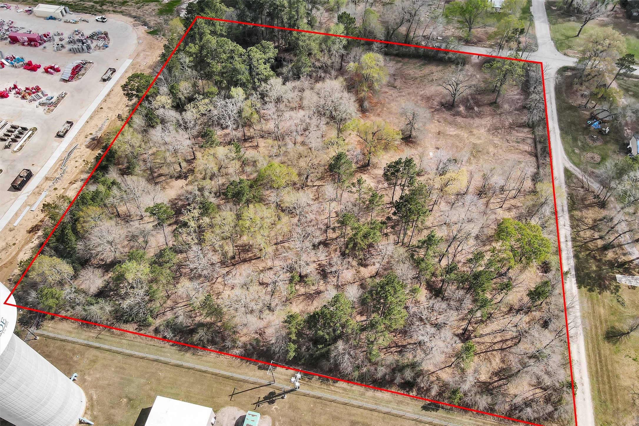 2921 Beasley Road Conroe, TX 77301 - Photo 2 of 18 view of a backyard with plants