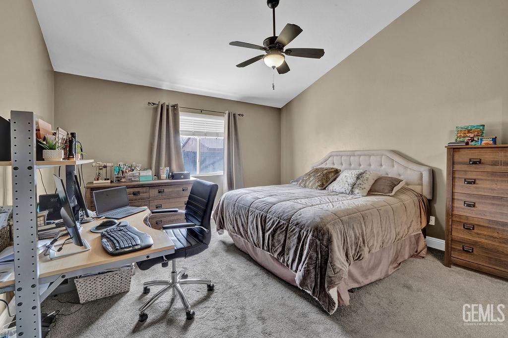 Undisclosed Address Bakersfield, CA 93307 - Photo 13 of 30 a spacious bedroom with a bed and a table