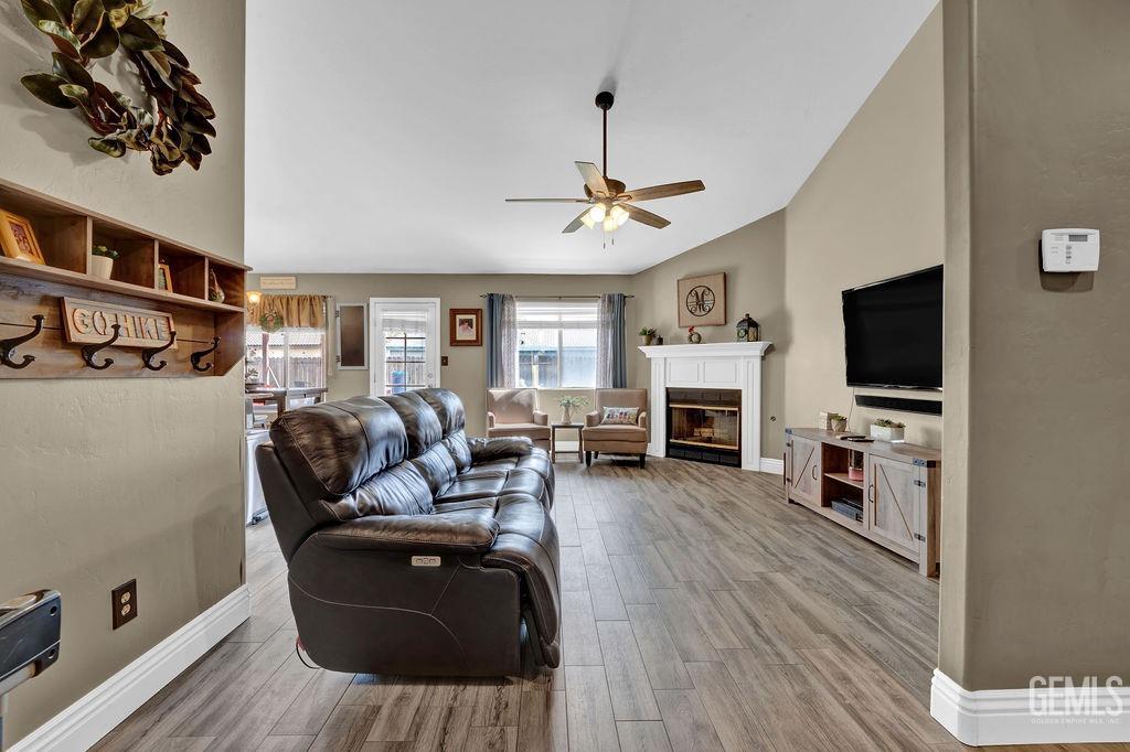 Undisclosed Address Bakersfield, CA 93307 - Photo 5 of 30 a living room with furniture fireplace and flat screen tv