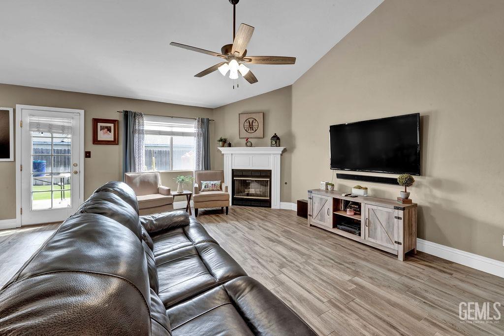 Undisclosed Address Bakersfield, CA 93307 - Photo 6 of 30 a living room with furniture and a flat screen tv