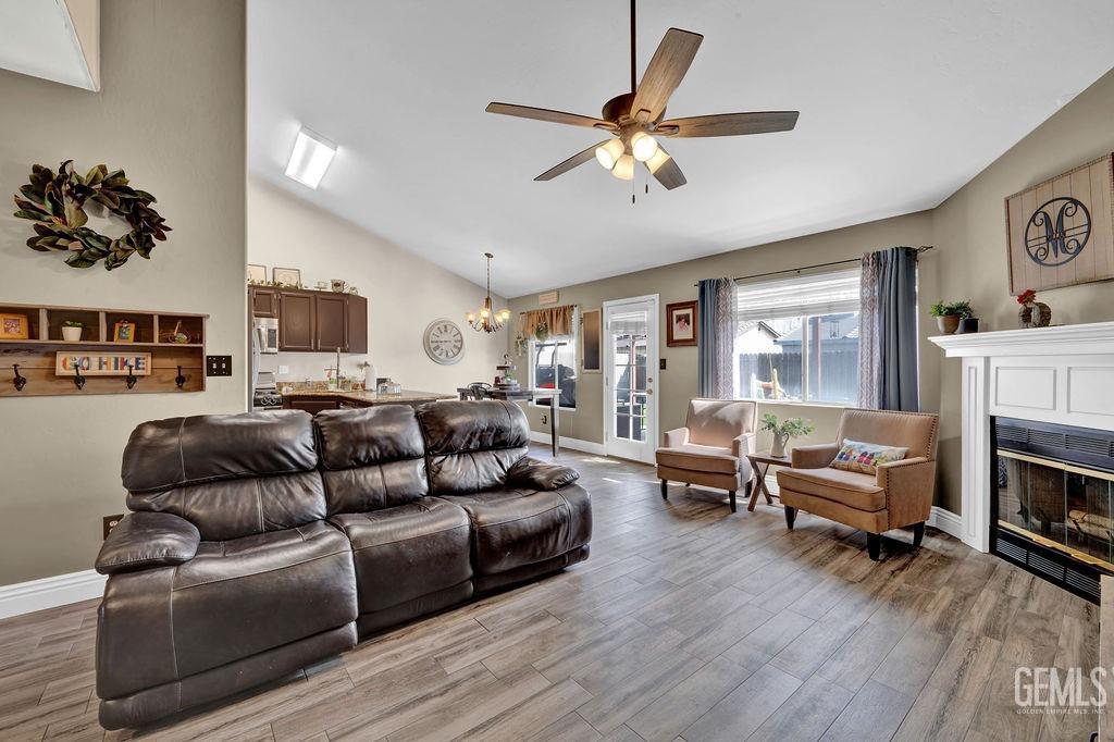 Undisclosed Address Bakersfield, CA 93307 - Photo 7 of 30 a living room with furniture and a fireplace