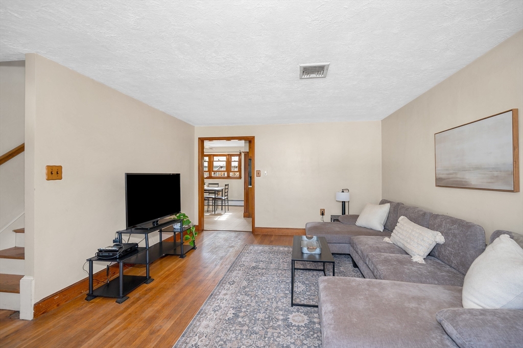 7 Marie Street Methuen, MA 01844 - Photo 10 of 39 a living room with furniture and a flat screen tv