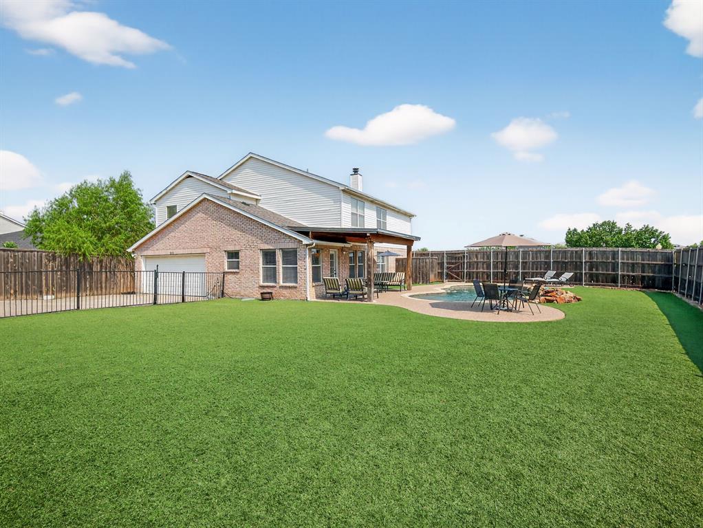 2052 Diamond Ridge Drive Carrollton, TX 75010 - Photo 15 of 40 a front view of a house with garden