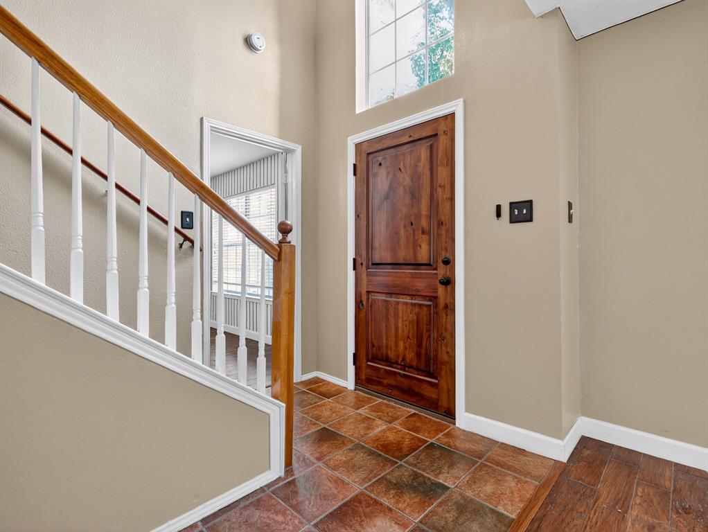 2052 Diamond Ridge Drive Carrollton, TX 75010 - Photo 21 of 40 a view of an entryway with wooden floor