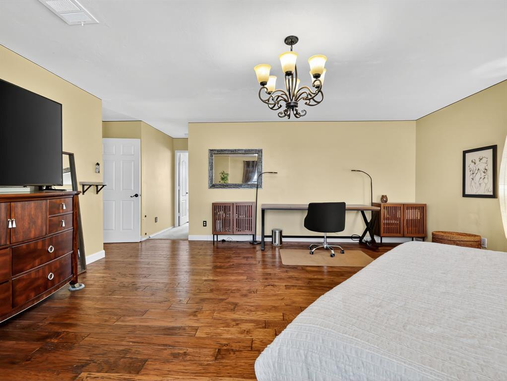 2052 Diamond Ridge Drive Carrollton, TX 75010 - Photo 22 of 40 a view of a livingroom with furniture and a flat screen tv