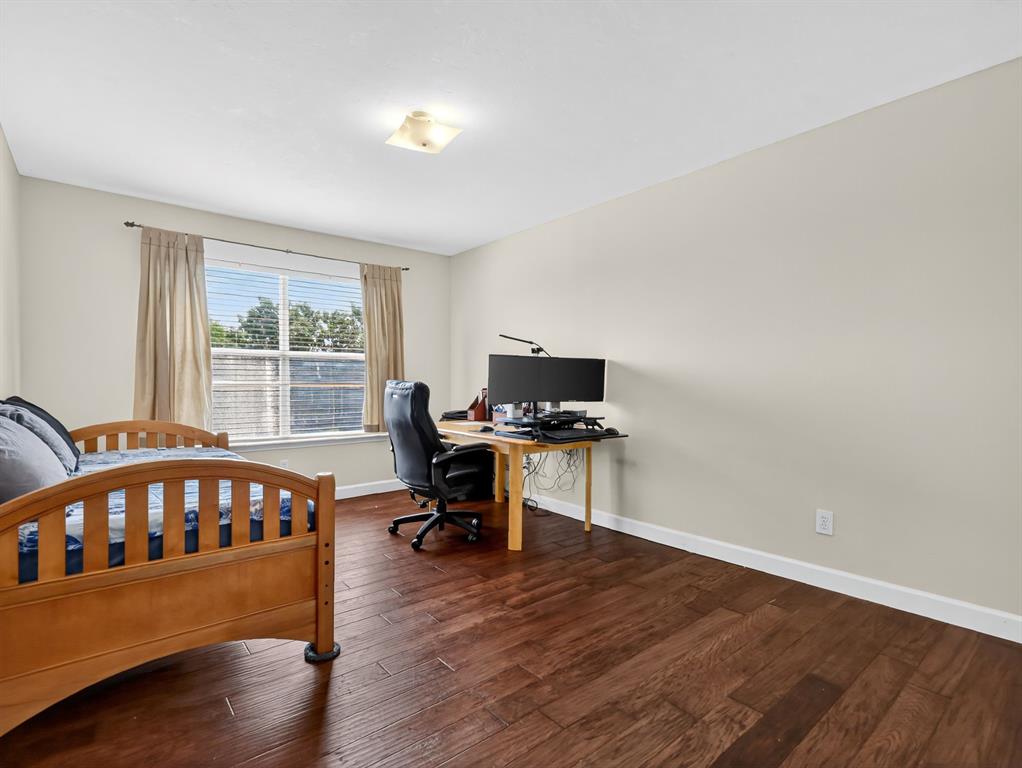 2052 Diamond Ridge Drive Carrollton, TX 75010 - Photo 24 of 40 a view of a workspace with furniture and a window
