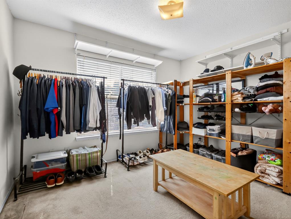 2052 Diamond Ridge Drive Carrollton, TX 75010 - Photo 27 of 40 a view of walk in closet with clothes and shoes