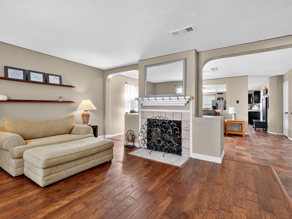 2052 Diamond Ridge Drive Carrollton, TX 75010 - Photo 29 of 40 a living room with furniture and a fireplace